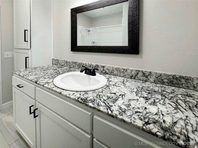 full bath featuring vanity