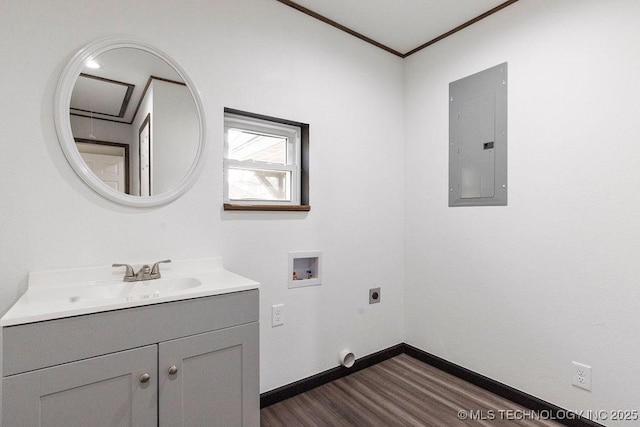 laundry area with hookup for an electric dryer, hookup for a washing machine, baseboards, dark wood finished floors, and electric panel