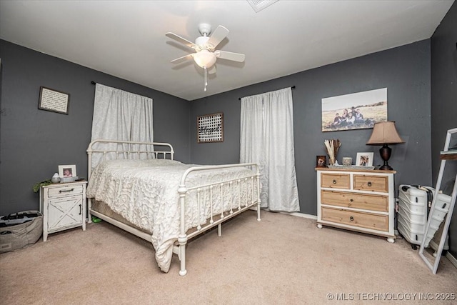 carpeted bedroom featuring a ceiling fan