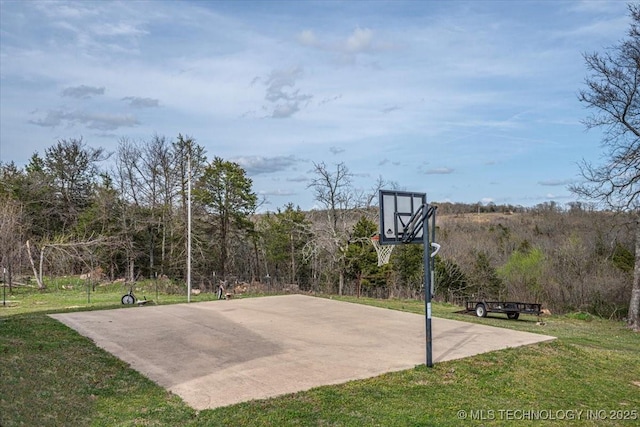 view of basketball court featuring a yard and community basketball court