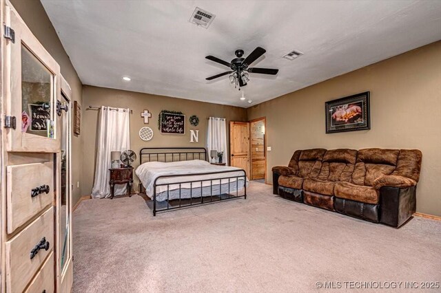 bedroom featuring baseboards, carpet flooring, ceiling fan, and visible vents