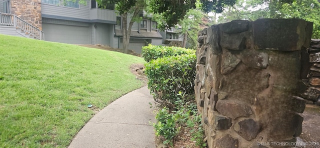 7502 S Winston Pl Unit 203, Tulsa, OK 74136 - view of grassy yard with an attached garage