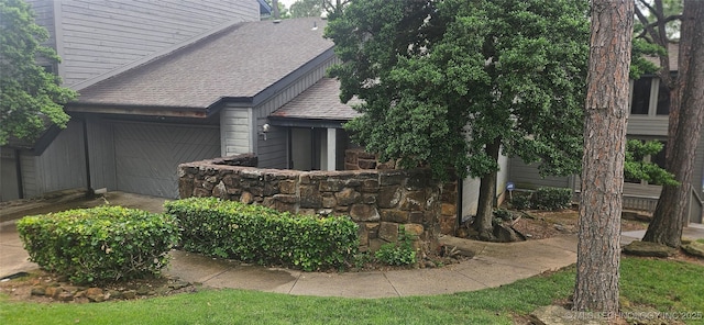 7502 S Winston Pl Unit 203, Tulsa, OK 74136 - view of side of property with roof with shingles