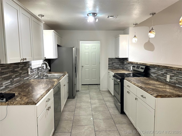 12924 E 34th St, Tulsa, OK 74134 - kitchen featuring a sink, white cabinetry, visible vents, and stainless steel appliances