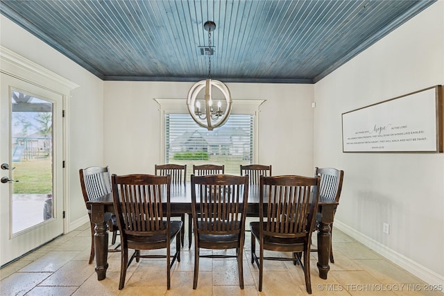19672 E 69th St N, Owasso, OK 74055 - dining room featuring a chandelier, crown molding, stone tile floors, and baseboards