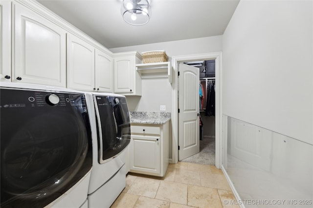 19672 E 69th St N, Owasso, OK 74055 - laundry room featuring separate washer and dryer, cabinet space, light stone finish flooring, and light carpet