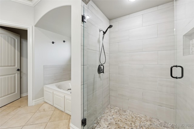19672 E 69th St N, Owasso, OK 74055 - full bath featuring a stall shower, a garden tub, crown molding, and baseboards