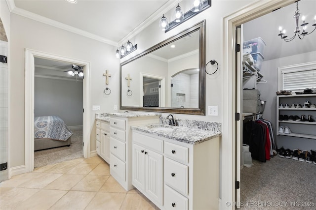19672 E 69th St N, Owasso, OK 74055 - ensuite bathroom featuring crown molding, a chandelier, vanity, ceiling fan, and tile patterned flooring