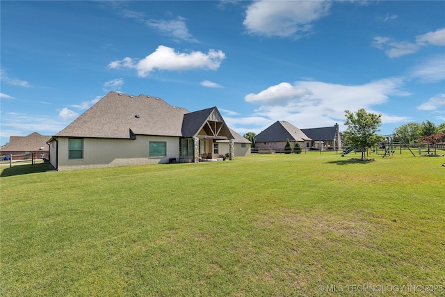 19672 E 69th St N, Owasso, OK 74055 - rear view of house featuring stucco siding and a shingled roof