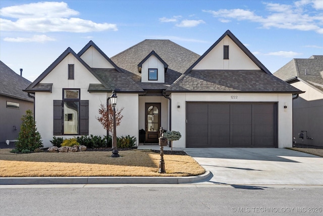 modern farmhouse style home with a garage, a shingled roof, concrete driveway, and stucco siding