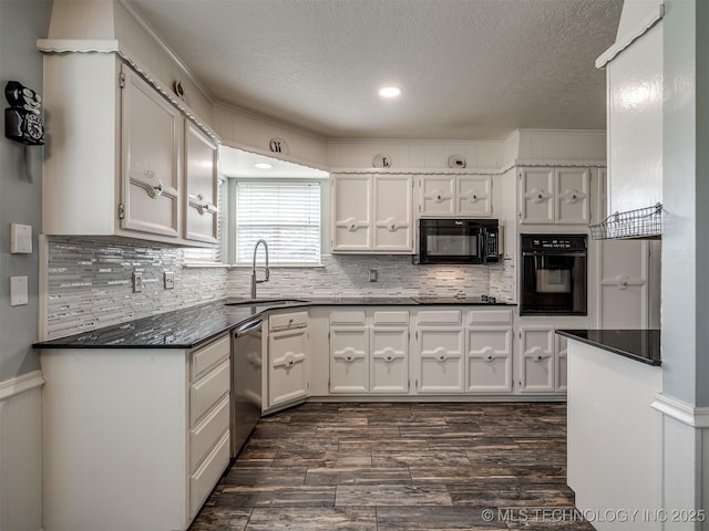 kitchen featuring white cabinetry, a sink, dark countertops, and black appliances