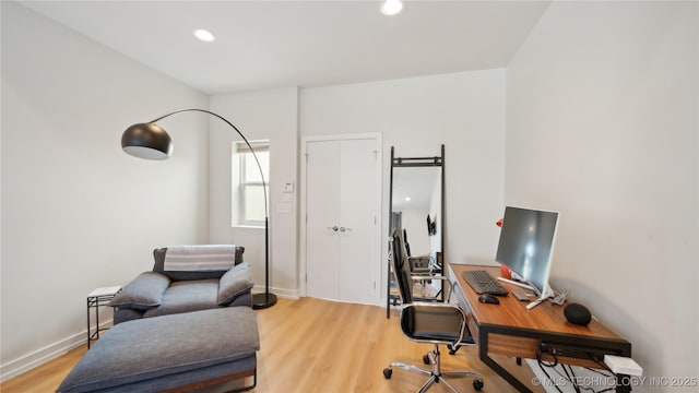 office area featuring light wood-style floors, recessed lighting, and baseboards
