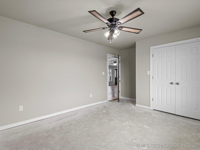 unfurnished bedroom with unfinished concrete floors, a closet, baseboards, and ceiling fan