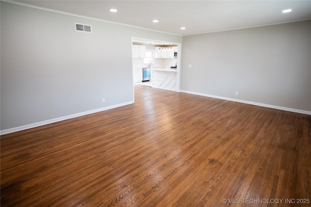 5760 E 29th St, Tulsa, OK 74114 - unfurnished room with baseboards, visible vents, crown molding, and dark wood-type flooring