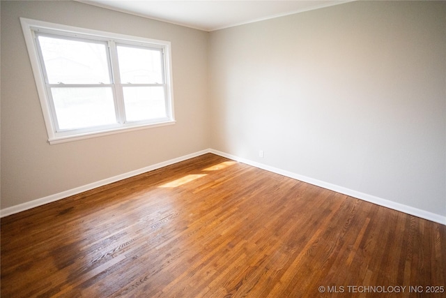 5760 E 29th St, Tulsa, OK 74114 - unfurnished room featuring baseboards and wood finished floors