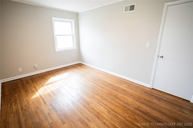 5760 E 29th St, Tulsa, OK 74114 - unfurnished room featuring baseboards, light wood-style flooring, and visible vents