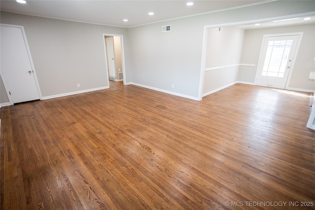 5760 E 29th St, Tulsa, OK 74114 - unfurnished room featuring wood finished floors, baseboards, visible vents, ornamental molding, and recessed lighting