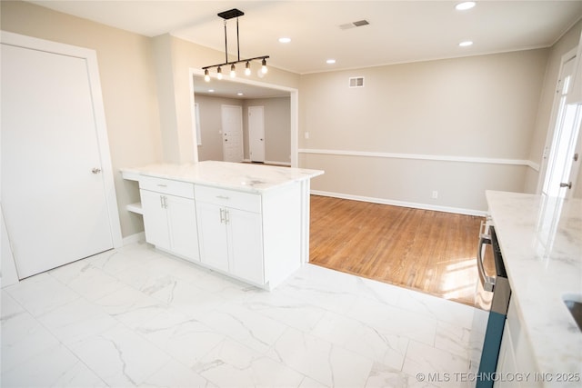 5760 E 29th St, Tulsa, OK 74114 - kitchen featuring white cabinetry, marble finish floor, light stone counters, and visible vents