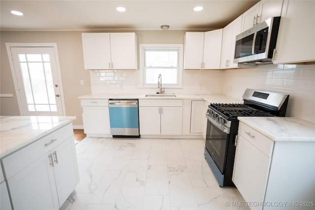 5760 E 29th St, Tulsa, OK 74114 - kitchen featuring recessed lighting, stainless steel appliances, marble finish floor, a sink, and light stone countertops