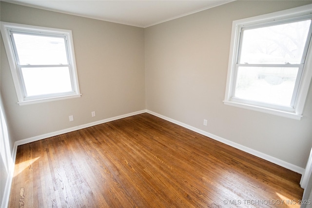 5760 E 29th St, Tulsa, OK 74114 - empty room with baseboards, crown molding, and wood finished floors