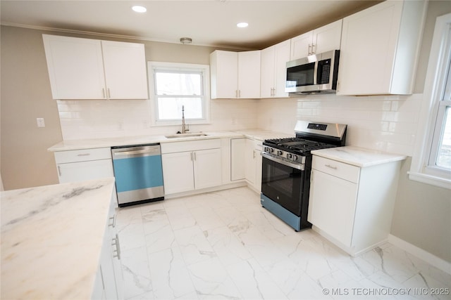 5760 E 29th St, Tulsa, OK 74114 - kitchen with a sink, tasteful backsplash, stainless steel appliances, marble finish floor, and white cabinets