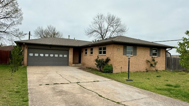 1721 S 114th E Ave, Tulsa, OK 74128 - ranch-style house featuring brick siding, driveway, fence, and an attached garage