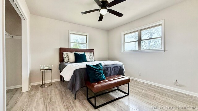 1721 S 114th E Ave, Tulsa, OK 74128 - bedroom with baseboards, light wood-type flooring, and ceiling fan