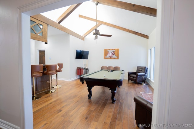 rec room with billiards table, beam ceiling, wood finished floors, a ceiling fan, and baseboards
