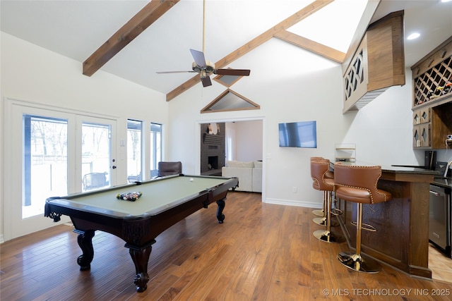 game room with ceiling fan, billiards table, beam ceiling, high vaulted ceiling, and wood finished floors
