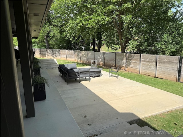 view of patio / terrace with a fenced backyard and an outdoor living space