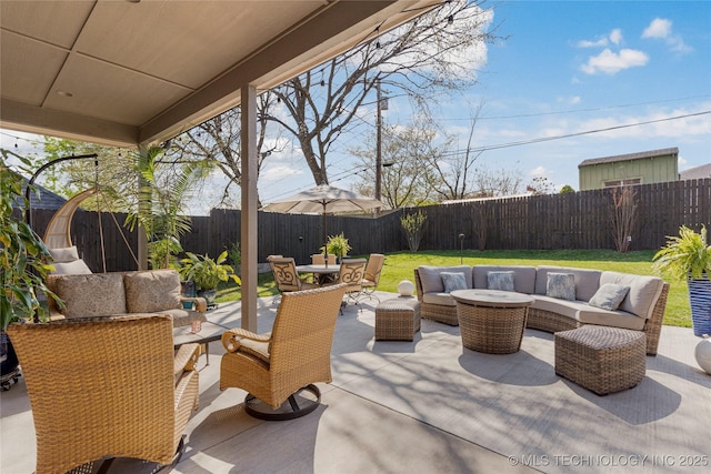 3528 S Wheeling Ave, Tulsa, OK 74105 - fenced backyard with outdoor lounge area, outdoor dining space, and a patio