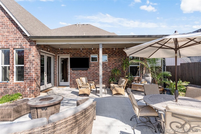 3528 S Wheeling Ave, Tulsa, OK 74105 - view of patio / terrace with an outdoor living space with a fire pit and french doors