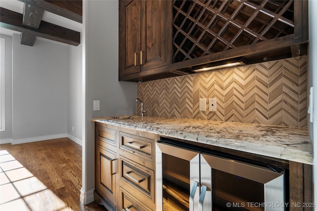 3528 S Wheeling Ave, Tulsa, OK 74105 - bar featuring beverage cooler, wood finished floors, and tasteful backsplash