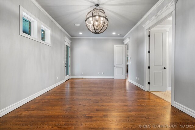 3528 S Wheeling Ave, Tulsa, OK 74105 - empty room with a chandelier, crown molding, recessed lighting, and wood finished floors