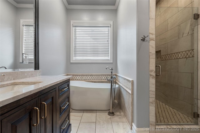 3528 S Wheeling Ave, Tulsa, OK 74105 - bathroom with vanity, a freestanding tub, a shower stall, crown molding, and tile patterned flooring