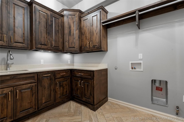 3528 S Wheeling Ave, Tulsa, OK 74105 - laundry area featuring hookup for a gas dryer, cabinet space, and washer hookup