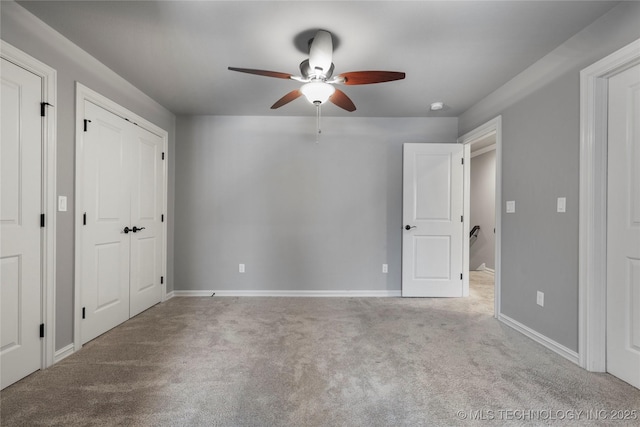 3528 S Wheeling Ave, Tulsa, OK 74105 - unfurnished bedroom featuring carpet floors, multiple closets, and ceiling fan