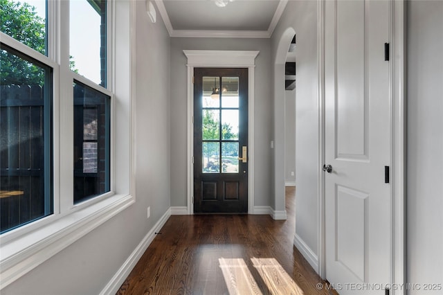 3528 S Wheeling Ave, Tulsa, OK 74105 - entryway featuring dark wood-style floors, arched walkways, and ornamental molding