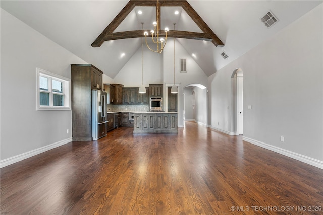 3528 S Wheeling Ave, Tulsa, OK 74105 - unfurnished living room with arched walkways, high vaulted ceiling, a chandelier, beamed ceiling, and dark wood-style flooring