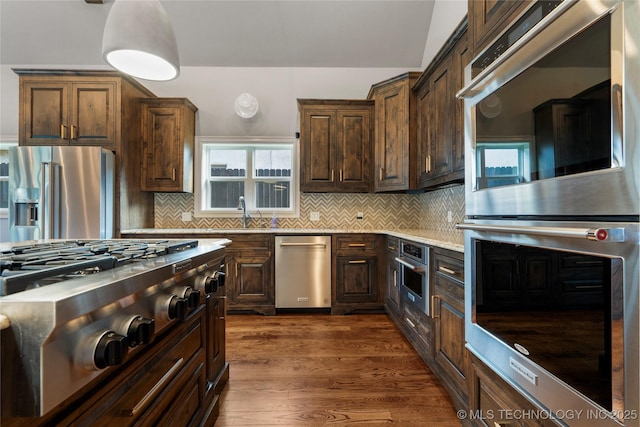 3528 S Wheeling Ave, Tulsa, OK 74105 - kitchen featuring stainless steel appliances, tasteful backsplash, dark wood-style floors, and healthy amount of natural light
