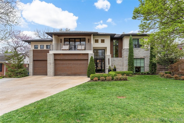 1623 E 33rd St, Tulsa, OK 74105 - prairie-style house with a balcony, a garage, driveway, a front yard, and stucco siding