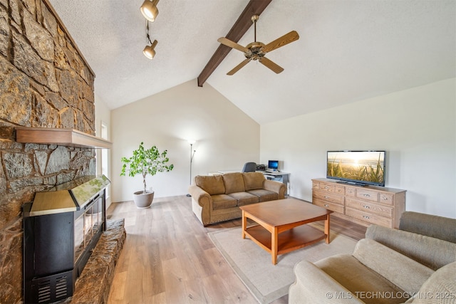 13542 N 155th E Ave, Collinsville, OK 74021 - living area with wood finished floors, ceiling fan, a stone fireplace, and an office area
