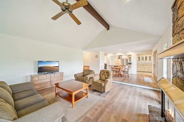 13542 N 155th E Ave, Collinsville, OK 74021 - living area with beamed ceiling, light wood finished floors, ceiling fan, and high vaulted ceiling