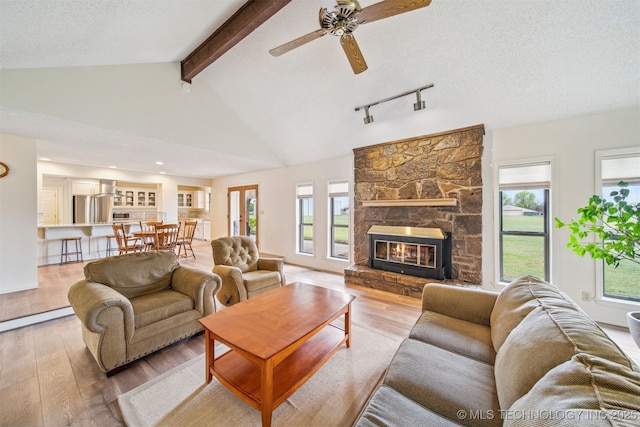 13542 N 155th E Ave, Collinsville, OK 74021 - living area with wood finished floors, plenty of natural light, ceiling fan, and a textured ceiling