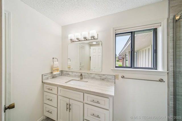 13542 N 155th E Ave, Collinsville, OK 74021 - full bath with vanity, a textured ceiling, tasteful backsplash, and an enclosed shower
