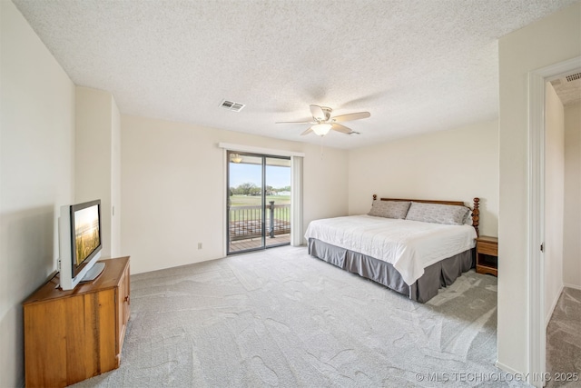 13542 N 155th E Ave, Collinsville, OK 74021 - carpeted bedroom featuring access to outside, a textured ceiling, and ceiling fan