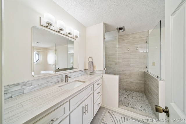 13542 N 155th E Ave, Collinsville, OK 74021 - full bath featuring vanity, a stall shower, tasteful backsplash, a textured ceiling, and tile patterned floors