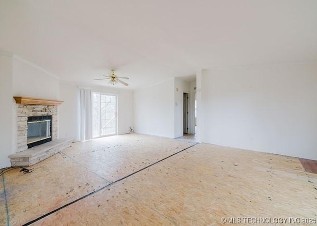 unfurnished living room featuring a ceiling fan and a fireplace