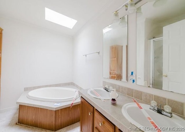 full bathroom with a sink, a skylight, and double vanity