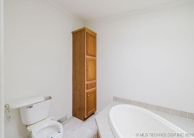 full bathroom featuring toilet, crown molding, a garden tub, and visible vents